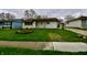 Inviting single-story home boasting a lush front lawn and easy access driveway at 7367 Parkside Dr, Indianapolis, IN 46226