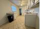 Spacious kitchen with ample storage, tile floors and a view of the exterior at 7367 Parkside Dr, Indianapolis, IN 46226