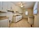 Functional kitchen featuring classic white cabinets and a practical tile floor at 7367 Parkside Dr, Indianapolis, IN 46226