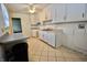 Bright kitchen with white cabinets and appliances, offering a clean design at 7367 Parkside Dr, Indianapolis, IN 46226