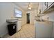 Well-maintained kitchen with tile flooring and natural light enhancing its appeal at 7367 Parkside Dr, Indianapolis, IN 46226