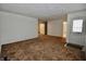 Comfortable living room with neutral carpet, ready for personalization and decor at 7367 Parkside Dr, Indianapolis, IN 46226