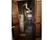 A utility closet featuring a hot water tank and a Goodman furnace at 7367 Parkside Dr, Indianapolis, IN 46226