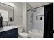 Stylish bathroom featuring a modern vanity, neutral paint, and walk-in shower at 7783 Park N Ct, Indianapolis, IN 46260