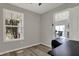 Bright office space with a large window and view into the living room at 7783 Park N Ct, Indianapolis, IN 46260