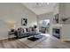 Inviting living room boasts a fireplace, plenty of natural light, and stylish decor at 7783 Park N Ct, Indianapolis, IN 46260