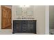Bathroom with double sinks, marble countertop, and dark-stained wood vanity at 7980 S State Road 135, Columbus, IN 47201