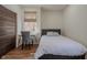 Comfortable bedroom with laminate floor, modern desk, and plenty of natural light at 7980 S State Road 135, Columbus, IN 47201