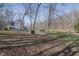 Exterior view of home and tree-lined property at 7980 S State Road 135, Columbus, IN 47201