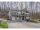 Charming two-story home boasts a double deck and a convenient attached two-car garage at 7980 S State Road 135, Columbus, IN 47201