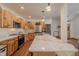 Well-equipped kitchen with marble countertops, wood cabinets, and stainless steel appliances at 7980 S State Road 135, Columbus, IN 47201