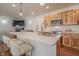 Modern kitchen with bar seating, stainless steel appliances, and wood cabinets at 7980 S State Road 135, Columbus, IN 47201