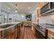 Spacious kitchen leading to living area, featuring marble counters and stainless steel appliances at 7980 S State Road 135, Columbus, IN 47201
