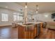 Open-concept kitchen with stainless steel appliances, an island, and adjacent dining area at 7980 S State Road 135, Columbus, IN 47201
