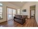 Bright living room with vaulted ceiling, slider to deck, and sofa bed at 7980 S State Road 135, Columbus, IN 47201