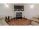 Cozy living room with modern fireplace, wooden floors, and comfortable seating area at 7980 S State Road 135, Columbus, IN 47201