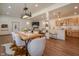 Open concept living space featuring dining area, living room, kitchen, and wood floors at 7980 S State Road 135, Columbus, IN 47201