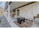 Large covered porch featuring porch swings and a fire pit, ideal for outdoor gatherings at 7980 S State Road 135, Columbus, IN 47201