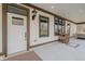 Spacious porch featuring an entry door with outdoor decor and ample space for seating at 7980 S State Road 135, Columbus, IN 47201