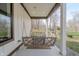 Inviting porch features a cozy swing, perfect for enjoying peaceful moments outdoors at 7980 S State Road 135, Columbus, IN 47201