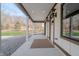 Covered porch featuring exterior lighting and plenty of room for outdoor seating and decor at 7980 S State Road 135, Columbus, IN 47201