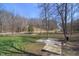 Wide shot of property with path and distant road at 7980 S State Road 135, Columbus, IN 47201
