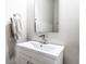 Clean bathroom with a white vanity, modern fixtures, towel and a mirror at 8405 Whitaker Valley Blvd, Indianapolis, IN 46237