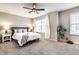 Bright bedroom with a cozy bed, bedside tables, and a leafy plant adding a fresh touch at 8405 Whitaker Valley Blvd, Indianapolis, IN 46237