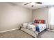 This bedroom has a ceiling fan, carpet flooring, and a themed bed at 8405 Whitaker Valley Blvd, Indianapolis, IN 46237