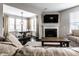 Cozy living room with fireplace, TV, and view of the dining area at 8405 Whitaker Valley Blvd, Indianapolis, IN 46237