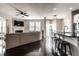 Open-concept living space featuring a kitchen island, living room, and dining area at 8405 Whitaker Valley Blvd, Indianapolis, IN 46237