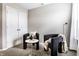 A sitting area features two chairs, a small table, and a decorative lamp for a relaxing space at 8405 Whitaker Valley Blvd, Indianapolis, IN 46237