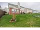 Green backyard with landscaping and view of home's back exterior at 8744 N Aspen Way, McCordsville, IN 46055