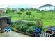 Lush backyard garden with patio and manicured lawn offers a serene outdoor retreat at 8744 N Aspen Way, McCordsville, IN 46055