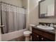 Cozy bathroom featuring a shower-tub combo with curtain and a vanity at 8744 N Aspen Way, McCordsville, IN 46055
