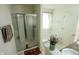 Bright bathroom featuring a glass enclosed shower and separate tub at 8744 N Aspen Way, McCordsville, IN 46055