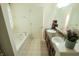Bright bathroom featuring a double vanity and a separate tub at 8744 N Aspen Way, McCordsville, IN 46055