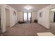 Spacious bedroom with neutral carpet, chandelier, and exercise equipment at 8744 N Aspen Way, McCordsville, IN 46055