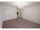 Carpeted bedroom with a chandelier and a closet at 8744 N Aspen Way, McCordsville, IN 46055