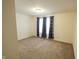 Spacious bedroom with neutral carpet and curtains at 8744 N Aspen Way, McCordsville, IN 46055