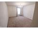 Bright, carpeted bedroom with chandelier and a large window letting in natural light at 8744 N Aspen Way, McCordsville, IN 46055
