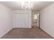 Carpeted bedroom with a closet and a chandelier at 8744 N Aspen Way, McCordsville, IN 46055
