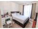 Bright bedroom with a large window, a comfortable bed, and natural light at 8744 N Aspen Way, McCordsville, IN 46055