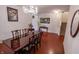 Spacious dining area with beautiful wood flooring and a chandelier at 8744 N Aspen Way, McCordsville, IN 46055