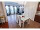 Bright dining area featuring a chandelier, table with seating and access to the living room at 8744 N Aspen Way, McCordsville, IN 46055