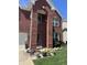 Charming two-story brick home with manicured lawn and flower beds at 8744 N Aspen Way, McCordsville, IN 46055