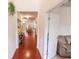Inviting hallway featuring hardwood floors and a view into the living areas at 8744 N Aspen Way, McCordsville, IN 46055