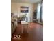 Bright home office space featuring wood floors, desk, modern decor, and natural light at 8744 N Aspen Way, McCordsville, IN 46055