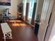 Bright office space featuring natural light with wood flooring, shelving unit and modern furnishings at 8744 N Aspen Way, McCordsville, IN 46055