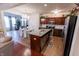 Modern kitchen with stainless steel appliances and a granite island at 8744 N Aspen Way, McCordsville, IN 46055